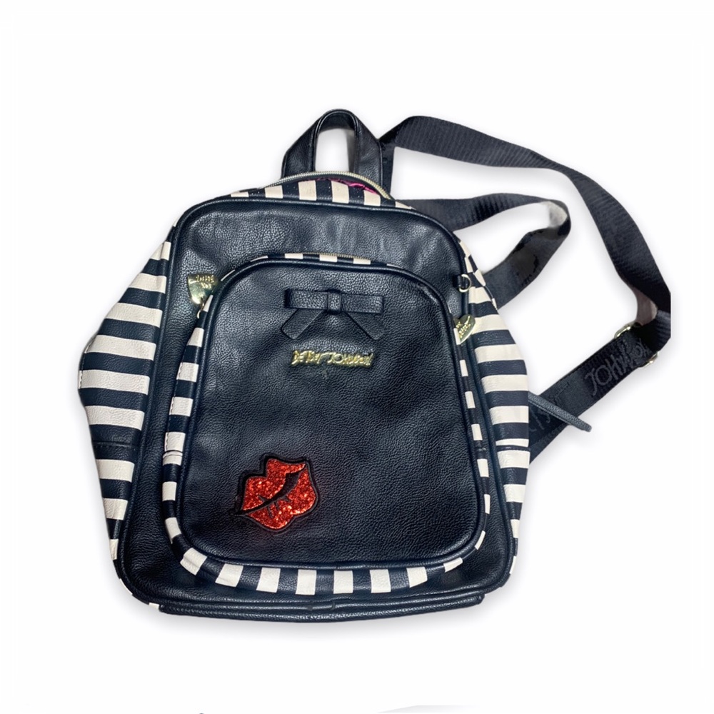 Black with striped Betsey Johnson backpack.